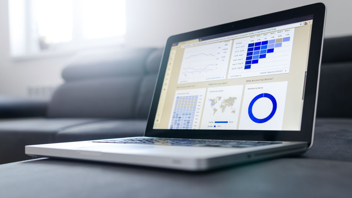 Sleek laptop showcasing data analytics and graphs on the screen in a bright room